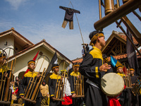 The Cireundeu Indigenous people are performing Angklung Buncis during the Ngemban Taun traditional ceremony in Cireundeu Village, West Java,...