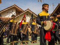 The Cireundeu Indigenous people are performing Angklung Buncis during the Ngemban Taun traditional ceremony in Cireundeu Village, West Java,...