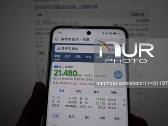 A young man is checking the share price of Intel on his mobile phone and computer in Shanghai, China, on August 3, 2024. Intel shares are fa...