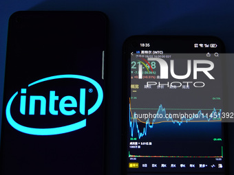 A mobile phone is showing Intel shares falling in Yichang, China, on August 3, 2024. (