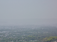 Smog is causing obscuration of the town of Dehradun in Uttarakhand, India, on April 19, 2024, due to active forest fires. (