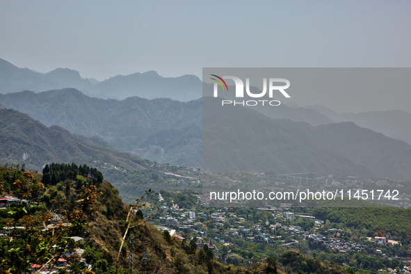 Smog is causing obscuration of the town of Dehradun in Uttarakhand, India, on April 19, 2024, due to active forest fires. 