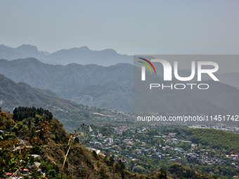 Smog is causing obscuration of the town of Dehradun in Uttarakhand, India, on April 19, 2024, due to active forest fires. (