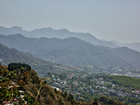 Smog is causing obscuration of the town of Dehradun in Uttarakhand, India, on April 19, 2024, due to active forest fires. (