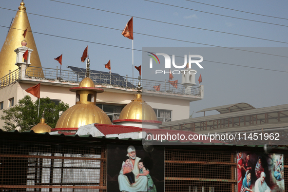 A small temple is being dedicated to Sai Baba in Dhampur, Uttarakhand, India, on April 19, 2024. 