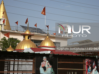 A small temple is being dedicated to Sai Baba in Dhampur, Uttarakhand, India, on April 19, 2024. (