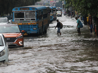 Vehicles are driving through a flooded street during the heavy monsoon rain in Kolkata, India, on August 3, 2024. (