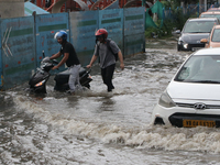 Vehicles are driving through a flooded street during the heavy monsoon rain in Kolkata, India, on August 3, 2024. (