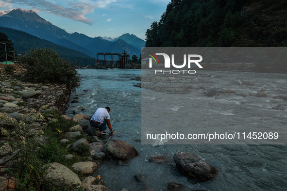 Tourists are enjoying in River Lidder on a hot summer day in Pahalgam, Jammu and Kashmir, India, on August 3, 2024. 