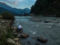 Tourists are enjoying in River Lidder on a hot summer day in Pahalgam, Jammu and Kashmir, India, on August 3, 2024. (