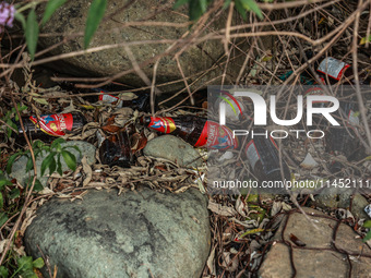 Empty bottles of Kingfisher beer are being thrown on the banks of River Lidder in Pahalgam, Jammu and Kashmir, India, on August 3, 2024. (