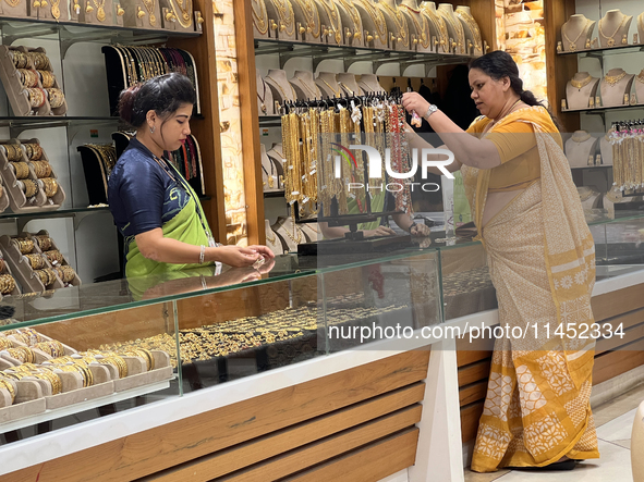 A woman is shopping for designer costume jewellery at a jewellery store in Thiruvananthapuram, Kerala, India, on April 08, 2024. 