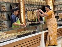 A woman is shopping for designer costume jewellery at a jewellery store in Thiruvananthapuram, Kerala, India, on April 08, 2024. (