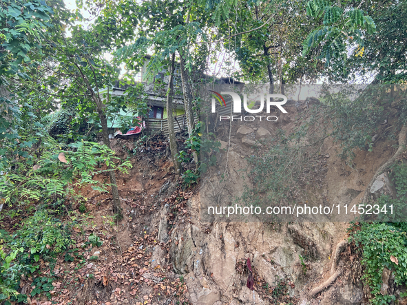 A hillside is being damaged by a landslide near a home in Thiruvananthapuram (Trivandrum), Kerala, India, on March 31, 2024. 