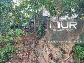 A hillside is being damaged by a landslide near a home in Thiruvananthapuram (Trivandrum), Kerala, India, on March 31, 2024. (