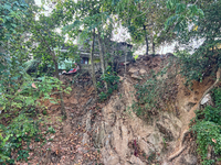 A hillside is being damaged by a landslide near a home in Thiruvananthapuram (Trivandrum), Kerala, India, on March 31, 2024. (