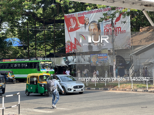 A large political banner for LDF Party candidate Pannian Raveendran is being displayed for the upcoming Lok Sabha 2024 election in Thiruvana...