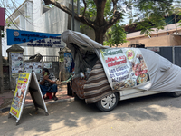 A man is selling pre-made biryani from the back of a vehicle along the roadside in Thiruvananthapuram (Trivandrum), Kerala, India, on March...