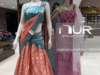 Fancy sarees are being displayed at a textile shop in Thiruvananthapuram, Kerala, India, on April 10, 2024. (