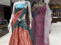 Fancy sarees are being displayed at a textile shop in Thiruvananthapuram, Kerala, India, on April 10, 2024. (