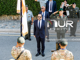 President of Cyprus Nikos Christodoulides is singing during the play of the national anthem in Kykkos, Cyprus, on August 4, 2024. President...