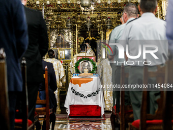 A photograph of Makarios is being seen on a table with the flag of Cyprus during the service in Kykkos, Cyprus, on August 4, 2024. The Presi...