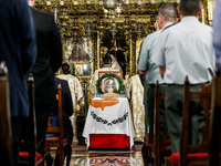 A photograph of Makarios is being seen on a table with the flag of Cyprus during the service in Kykkos, Cyprus, on August 4, 2024. The Presi...