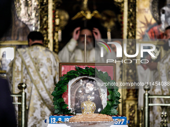 A photograph of Makarios is being seen during the service in Kykkos, Cyprus, on August 4, 2024. President of Cyprus Nikos Christodoulides is...