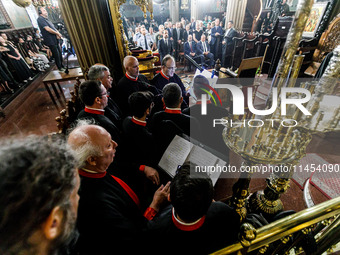 Chanters are being seen during the service in Kykkos, Cyprus, on August 4, 2024. President of Cyprus Nikos Christodoulides is attending the...