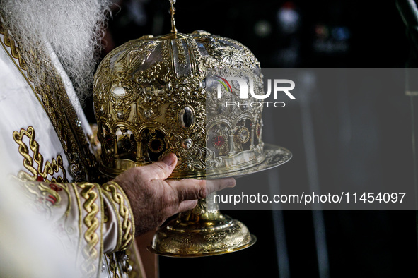 Archbishop Georgios of Cyprus is holding a golden crown during the service in Kykkos, Cyprus, on August 4, 2024. President of Cyprus Nikos C...