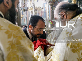 President of Cyprus Nikos Christodoulides is about to get the Holy Communion in Kykkos, Cyprus, on August 4, 2024. President of Cyprus Nikos...