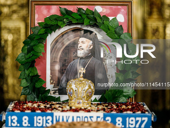 A photograph of Makarios is being seen during the service in Kykkos, Cyprus, on August 4, 2024. President of Cyprus Nikos Christodoulides is...