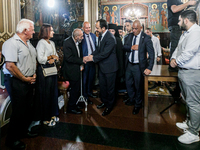 President of Cyprus Nikos Christodoulides is greeting a civilian in Kykkos, Cyprus, on August 4, 2024. President of Cyprus Nikos Christodoul...