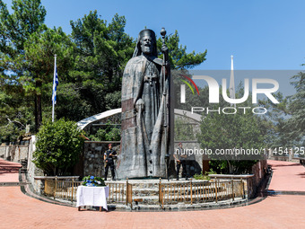 Two soldiers are standing in front of the Makarios statue in Kykkos, Cyprus, on August 4, 2024. The President of Cyprus, Nikos Christodoulid...