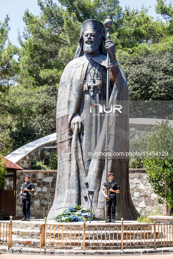 Two soldiers are standing in front of the Makarios statue in Kykkos, Cyprus, on August 4, 2024. The President of Cyprus, Nikos Christodoulid...