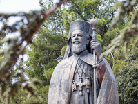 A Makarios statue is being seen through a tree in Kykkos, Cyprus, on August 4, 2024. The President of Cyprus, Nikos Christodoulides, is atte...