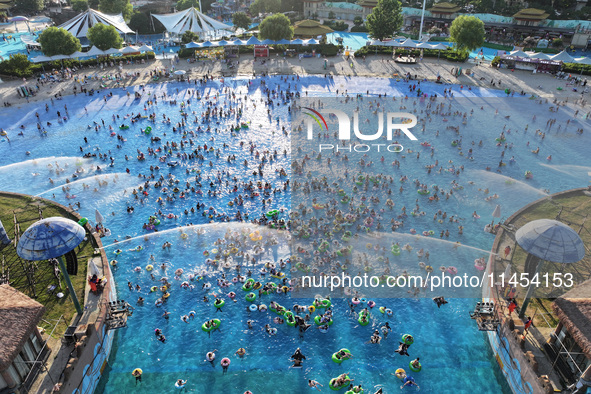 People are enjoying the cool water at a water park in Nanjing, China, on August 4, 2024. 