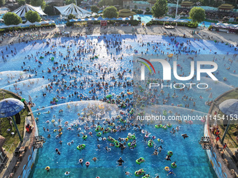 People are enjoying the cool water at a water park in Nanjing, China, on August 4, 2024. (