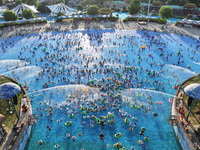 People are enjoying the cool water at a water park in Nanjing, China, on August 4, 2024. (