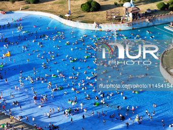 People are enjoying the cool water at a water park in Nanjing, China, on August 4, 2024. (