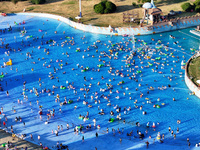 People are enjoying the cool water at a water park in Nanjing, China, on August 4, 2024. (