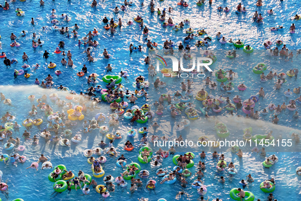 People are enjoying the cool water at a water park in Nanjing, China, on August 4, 2024. 