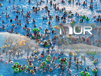 People are enjoying the cool water at a water park in Nanjing, China, on August 4, 2024. (