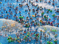 People are enjoying the cool water at a water park in Nanjing, China, on August 4, 2024. (