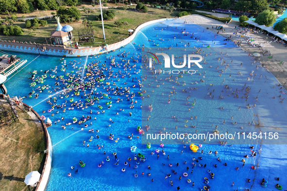 People are enjoying the cool water at a water park in Nanjing, China, on August 4, 2024. 