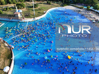 People are enjoying the cool water at a water park in Nanjing, China, on August 4, 2024. (