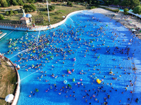 People are enjoying the cool water at a water park in Nanjing, China, on August 4, 2024. (