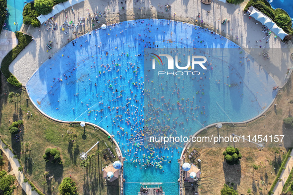 People are enjoying the cool water at a water park in Nanjing, China, on August 4, 2024. 