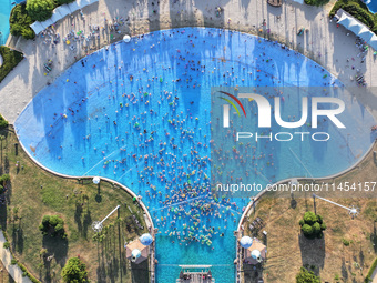 People are enjoying the cool water at a water park in Nanjing, China, on August 4, 2024. (