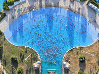 People are enjoying the cool water at a water park in Nanjing, China, on August 4, 2024. (